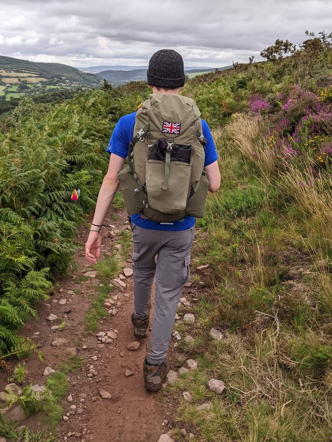 Fieldwork in the UK uplands, hiking with a field pack across moorland